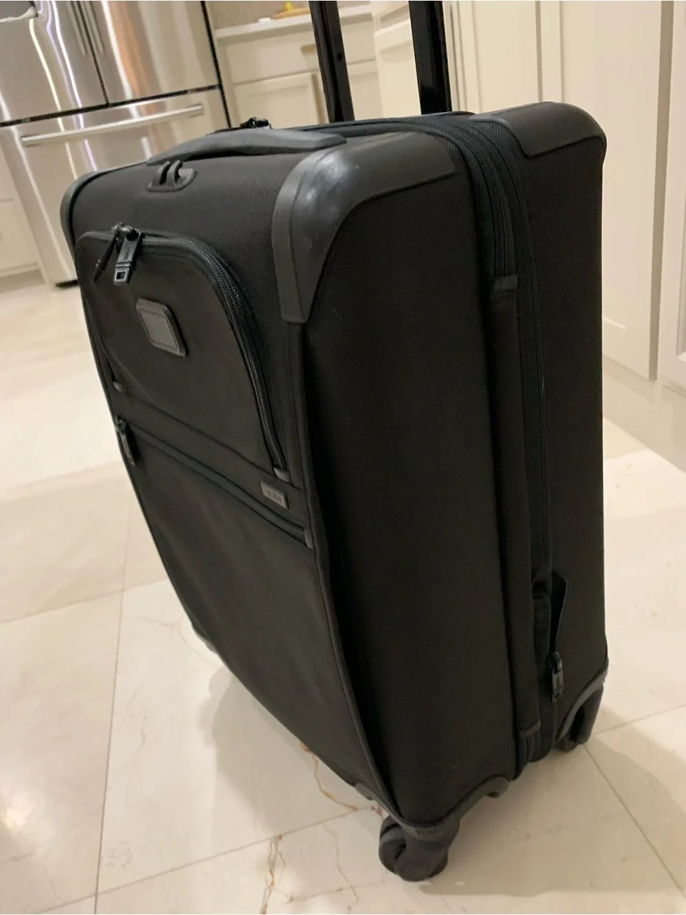 Tumi Black Spinner Carry-On with Front Zip Pocket luggage